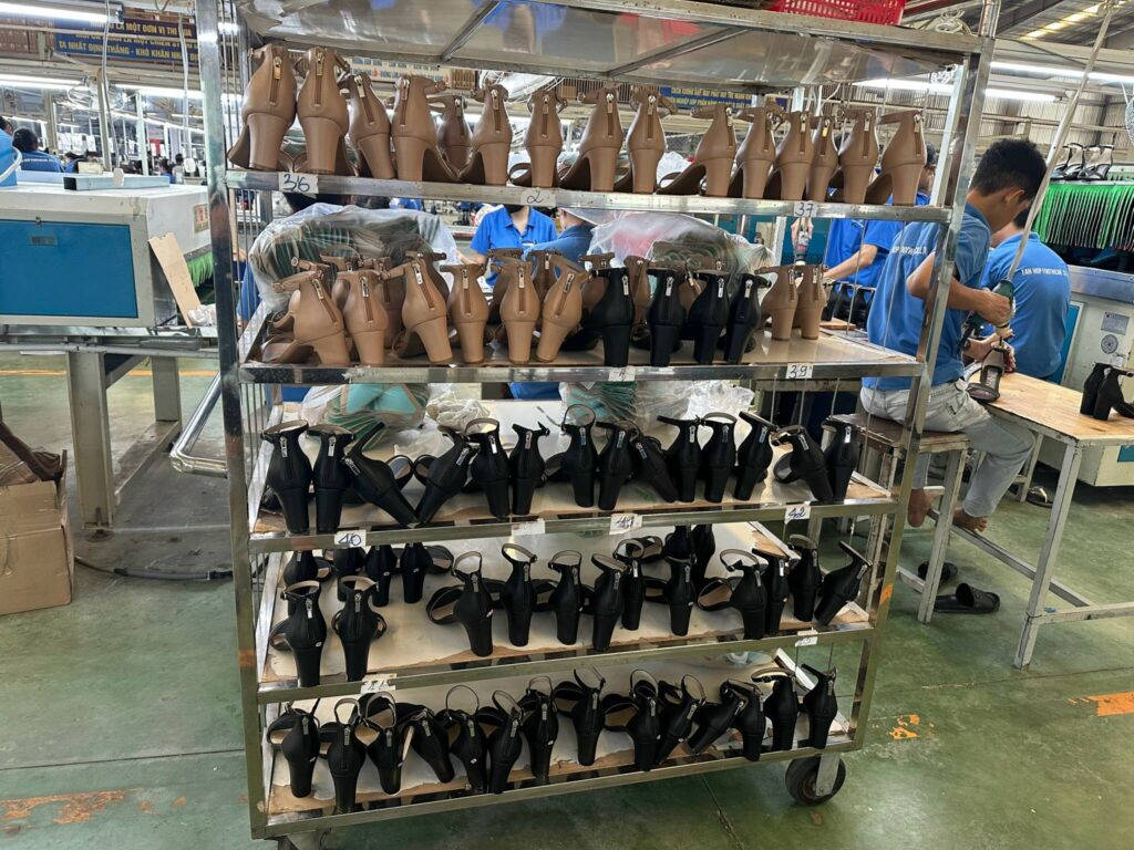 Quality control and assembly line of export footwear manufacturing in a Vietnamese factory. Quality control and assembly line of export footwear manufacturing in a Vietnamese factory.